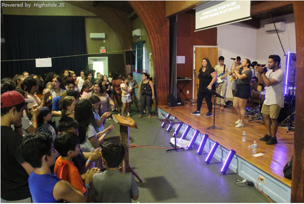 A worship team and crowd singing